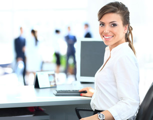 business woman with team working on laptop