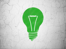 Business Concept: Light Bulb On Wall Background