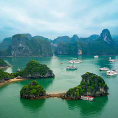 Tourist junks among limestone rocks. Ha Long Bay, Vietnam