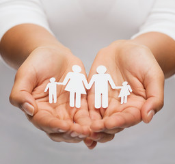 Wall Mural - womans hands with paper man family