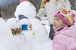 © TAGSTOCK2 - snowman and girl