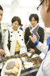 man and woman buying Japanese pot-au-feu at convenience store