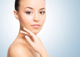 Portrait of a young and healthy girl on a blue background