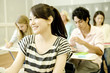 © TAGSTOCK2 - smiling female student  studying in classroom
