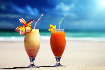 fresh fruit juices on a tropical beach