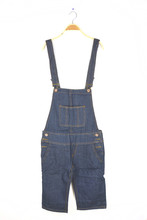 Hanging Dungarees On White Wall