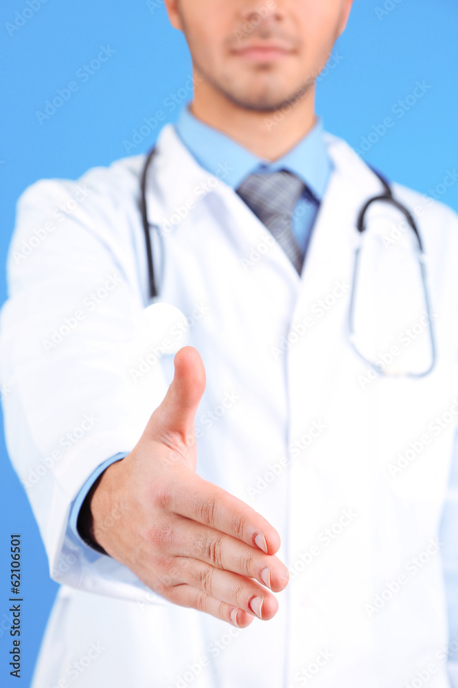 Male Doctor on blue background