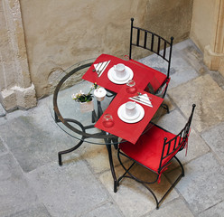 Street served forged table and chairs