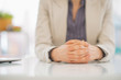 © Alliance - Closeup on business woman sitting at desk