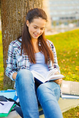 Canvas Print - smiling teenager reading book