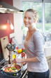 © jackfrog - beautiful young woman cooking at home