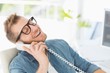 © WavebreakmediaMicro - Handsome designer laughing on the telephone