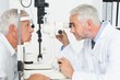 © WavebreakMediaMicro - Optometrist doing sight testing for senior patient