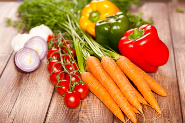 Wall Mural - Fresh vegetables on a wooden table