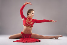 Gorgeous Sporty Woman In Red Clothing. Chinese Dancing