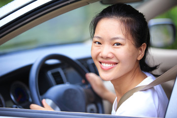 Wall Mural - happy woman driver with her first car