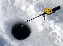 Fishing Line In Hole Drilled In Ice