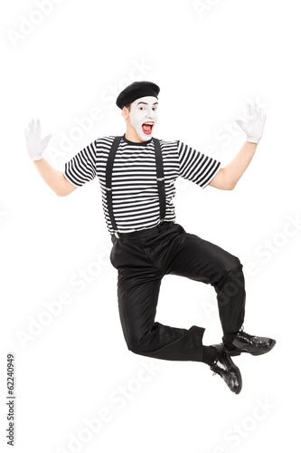 Obraz na plátně Full length portrait of mime artist jumping with joy