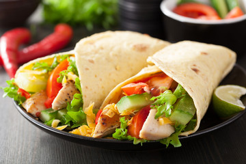 Wall Mural - mexican tortilla wrap with chicken breast and vegetables