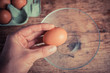 Hand cracking egg