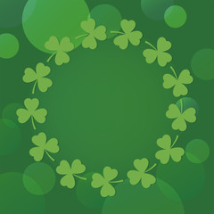 st patricks day background with shamrock wreath on green bokeh