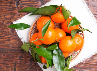 Wall Mural - Tangerines on wooden table