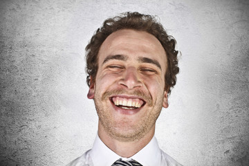 Positive businessman laughing