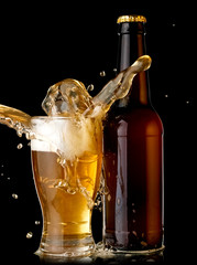 Beer bottle and glass splash