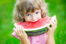 Happy Child Eating Watermelon