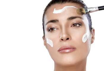 Wall Mural - beautiful spa girl with cream on her face. skincare concept
