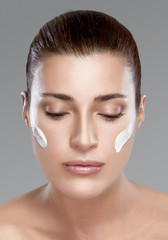 Wall Mural - spa girl with cream on her face. skincare concept