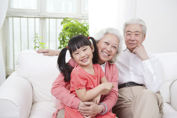 .Senior couple with granddaughter.