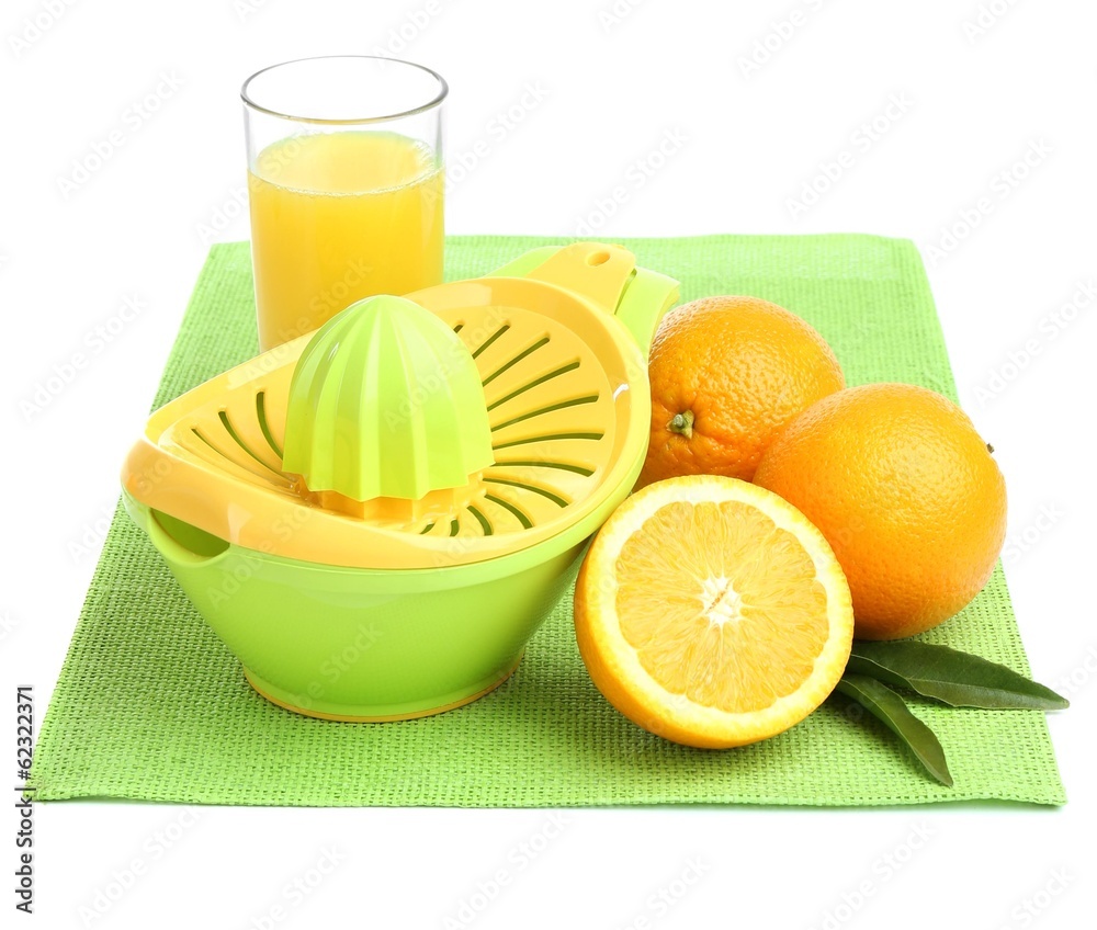 Citrus press and oranges isolated on white