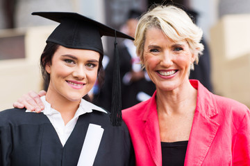 young female graduate and mother at ceremony