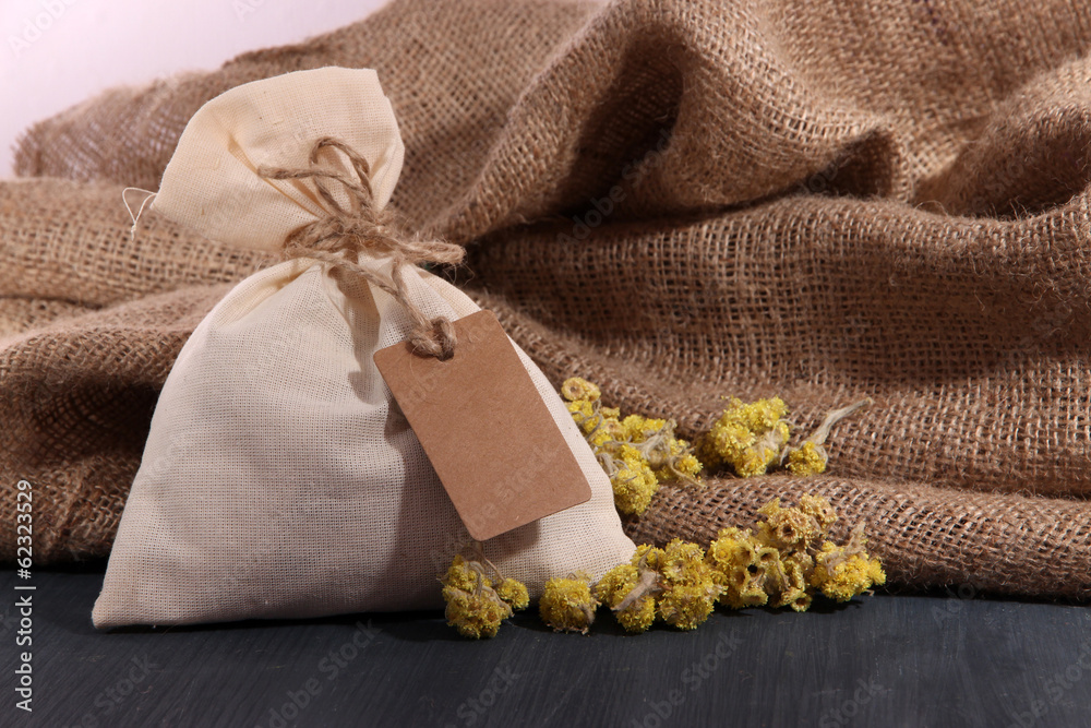 Textile sachet pouch with dried flowers