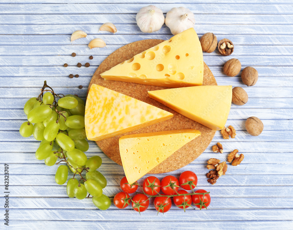 Different Italian cheese on wooden table
