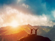 © Photocreo Bednarek - Happy couple together on the peak of a mountain at sunset