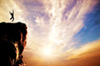 © Photocreo Bednarek - A man jumping for joy on the peak of the mountain