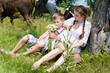 © stormy - boy & beautiful young woman and cows in summer