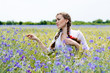 © stormy - beautiful girl standing in yellow wheat and bluette field