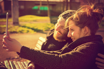 young couple in love using tablet