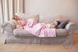 © Wavebreak Media - Two young girls sleeping on couch