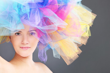 Wall Mural - Woman in a rainbow hat