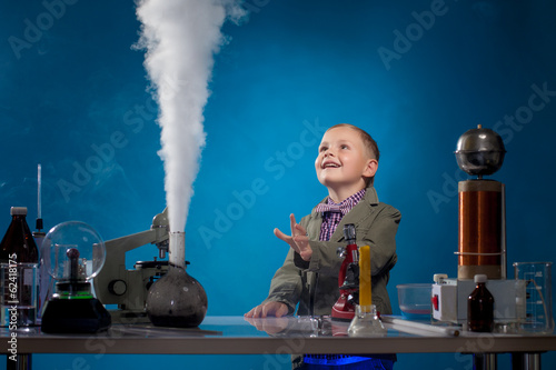 Fotografie, Obraz Image of joyful boy watching reagent evaporation