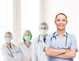 Canvas Print - smiling female doctor or nurse with stethoscope