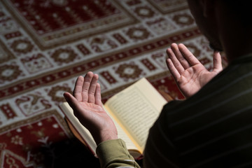 Muslim Man Is Reading The Koran