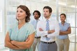© lightwavemedia - Business group with arms crossed in office