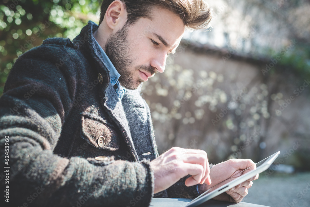 young handsome fashion model using tablet man の Stock フォト | Adobe Stock