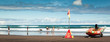 People having fun on Karekare Beach, New Zealand, Panorama