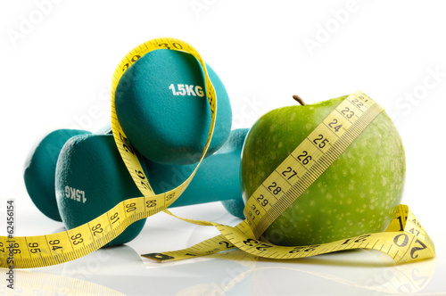 Fotografía healthy apple, measuring tape and dumbbells isolated